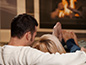 Couple by fireplace