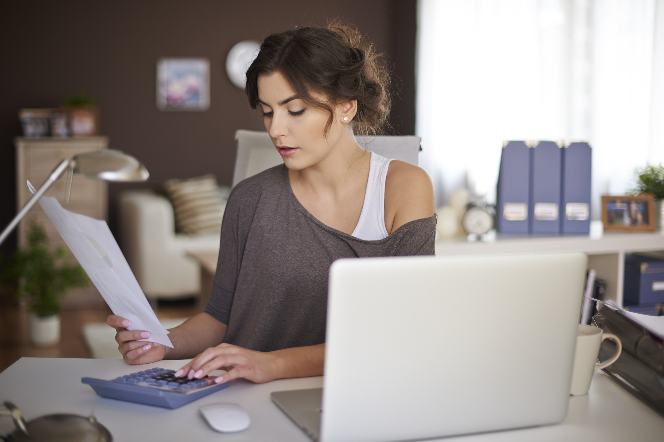 Young woman learning to track expenses